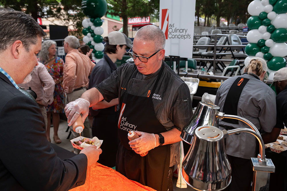 Caterer serving food at Soiree Event